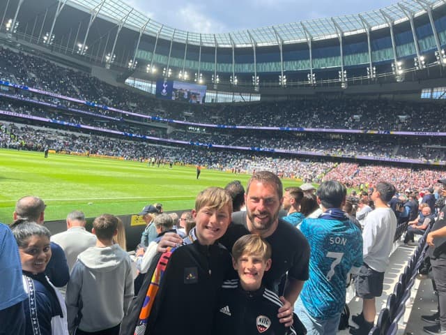 Steve Whitfield smiling on a football pitch